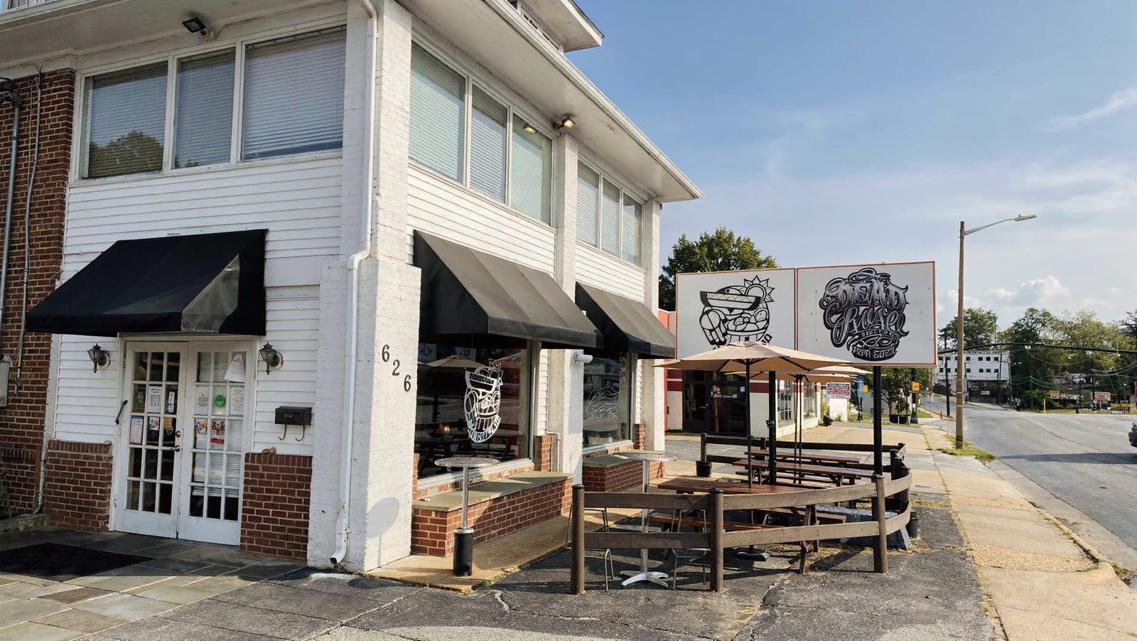 La Tingeria storefront at 626 S Washington St, Falls Church, VA, with outdoor patio seating and umbrellas